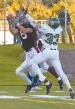 Junior wide-out Ryan Koch out jumps Danny Gagner (33) and comes down with a catch Saturday versus UND. The reception helped put the Huskies up 14-10. The Huskies upset No. 2 ranked UND 21-17.
