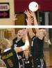 Outside hitters Lindsay Ashburn and Lindsey Gothe defend against a Bulldog offensive punch. The Husky defensive shield was not enough to stop UMD as they beat the Huskies in three games.